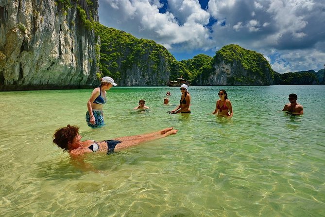 1 Day Boat Tour: HaLong Bay, Lan Ha Bay, Natural Beach and Full Moon Party - Ha Long Bay natural beach: jump in and explore caves on shore