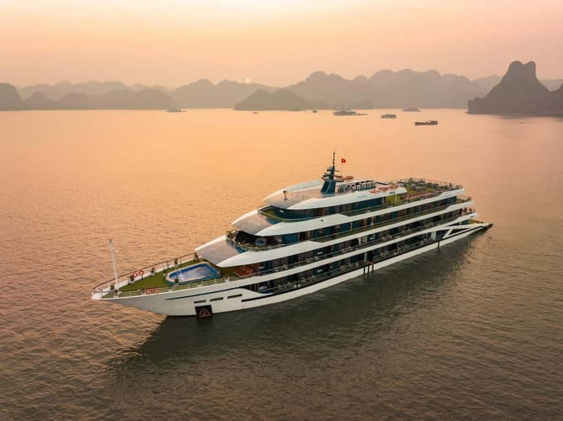 2-Day or 3-Day: Halong&Lan Ha Bay Cruise 5<em> balcony,bathtub – Key highlights worth planning around’ /></p>
<ul>
<li><strong>Balcony bathtub cabin</strong>: a proper place to chill between excursions, not just a bed and a view.</li>
<li><strong>Chef-guided cooking class</strong>: you get hands-on practice with classic Vietnamese dishes.</li>
<li><strong>Viet Hai Village by bike</strong>: you ride the scenic roads and visit a local family’s daily life.</li>
<li><strong>Dark and Bright Cave options</strong>: choose cave exploring by kayak or bamboo boat rowed by locals.</li>
<li><strong>Tra Bau swimming and kayaking</strong>: classic Halong-Lan Ha scenery near the Kong Skull Island filming area.</li>
<li><strong>Sunset party plus night activities</strong>: happy hour, squid fishing, karaoke, and more.</li>
</ul>
<div class="twil" style="margin: 20px 0; padding: 15px 0;"><p>Ha Long Bay, other ways onto the water</p><ul style="margin: 10px 0; padding-left: 0; list-style: none;"><li style="margin: 6px 0; line-height: 1.4;"><a href="https://lovingvietnam.com/hanoi-ha-long-bay-day-cruise-swimming-meal-kayaking/">Hanoi: Ha Long Bay Day Cruise – Swimming, Meal, Kayaking</a><span style="margin-left: 8px; font-size: 0.82em; color: #555; white-space: nowrap;"><span style="color: #a8600a;">★</span> 4.7 &middot; 7,415 reviews</span></li><li style="margin: 6px 0; line-height: 1.4;"><a href="https://lovingvietnam.com/amanda-cruise-ha-long-lan-ha-bay-all-inclusive-2d1n-3d2n/">Amanda Cruise – Ha Long, Lan Ha Bay – All Inclusive 2D1N & 3D2N</a><span style="margin-left: 8px; font-size: 0.82em; color: #555; white-space: nowrap;"><span style="color: #a8600a;">★</span> 5.0 &middot; 4,358 reviews</span></li><li style="margin: 6px 0; line-height: 1.4;"><a href="https://lovingvietnam.com/cozy-bay-halong-5-star-day-cruise-buffet-cave-kayak-swimming/">Cozy Bay Halong 5-Star Day Cruise, Buffet, Cave, Kayak, Swimming</a><span style="margin-left: 8px; font-size: 0.82em; color: #555; white-space: nowrap;"><span style="color: #a8600a;">★</span> 5.0 &middot; 3,512 reviews</span></li><li style="margin: 6px 0; line-height: 1.4;"><a href="https://lovingvietnam.com/hanoi-2-day-halong-lan-ha-bay-5-star-cruise-with-balcony/">Hanoi: 2-Day Halong & Lan Ha Bay 5-Star Cruise with Balcony</a><span style="margin-left: 8px; font-size: 0.82em; color: #555; white-space: nowrap;"><span style="color: #a8600a;">★</span> 4.8 &middot; 3,300 reviews</span></li></ul></div><h2 id="doria-5-star-comfort-balcony-bathtub-and-what-you-actually-get">Doria 5 star comfort, balcony bathtub, and what you actually get</h2>
<p><img width="487" height="650" decoding="async" src=