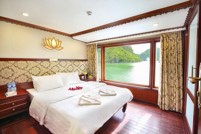 2-Day Oriental Sails Junk Cruise of Halong Bay - Day 2: tai chi at dawn, Luon Cave by sampan or kayak