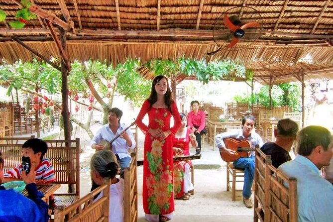 Adventure Cu Chi Tunnels and Mekong Delta Tour From HCM - Honey tea, fruit, coconut candy, and folk music stops