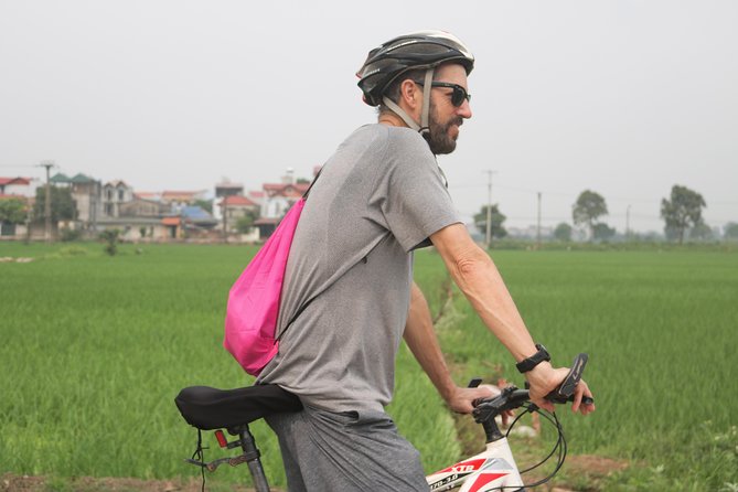 Bicycle Tour Full Day Explore Red River Delta & Rural Villages - Visiting a local market and a family farm stop