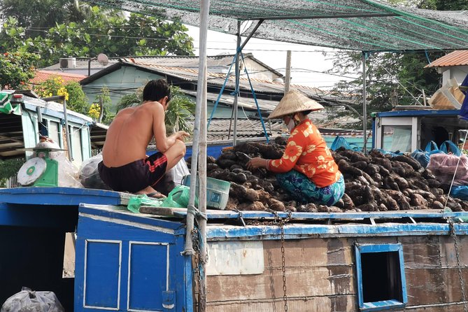 Cai Be Village - One-Day Mekong Delta Adventure - Sampan cruising in shady channels, plus crispy snacks and coconut candy