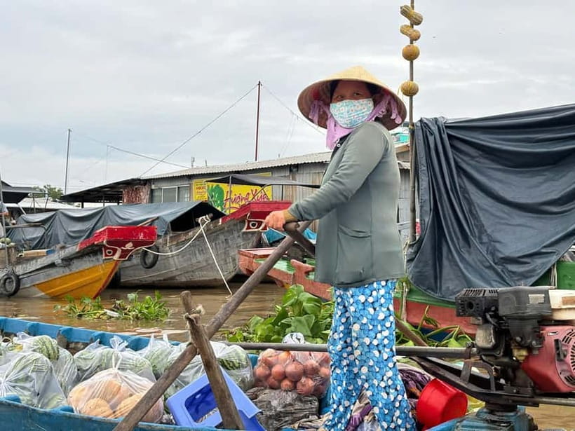 Can Tho: Floating Market, Cacao & Canals with French Guide - Can Tho at sunrise on a wooden sampan