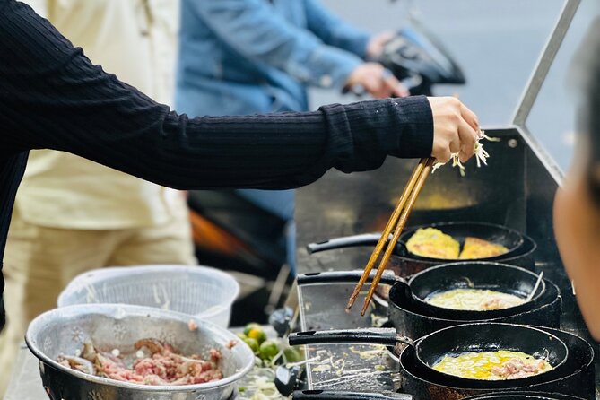 Committed Non-Touristy Saigon Street Food Tour By Scooters/Car - Stop 3: Phố Tau Sai Gon in Chợ Lớn, night energy with local flavor