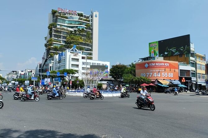 Da Nang Food Tour Motorbike & Sightseeing By Ao Dai Lady Rider - Stop 2: Dragon Bridge, plus the Friday or weekend water and fire show