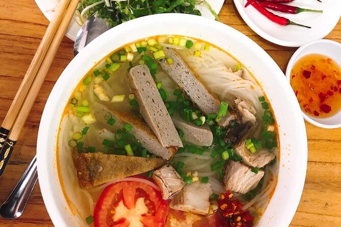 DaNang Night Foodie Tour-Sighseeing with Aodai Lady Rider Private - Dragon Bridge, Love Lock Bridge, and Han River Views at Night
