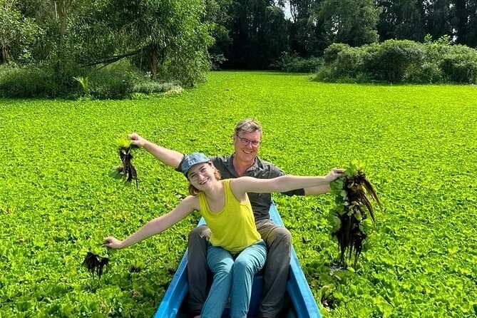 Discover Mua Xuan Nature Reserve - Boat cruising under water hyacinth and water lettuce