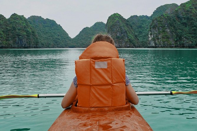 Excursion to Ha Long Bay with Titop Island and kayaking in Luon Cave - Boarding the junk: lunch, route rocks, and sunset treats