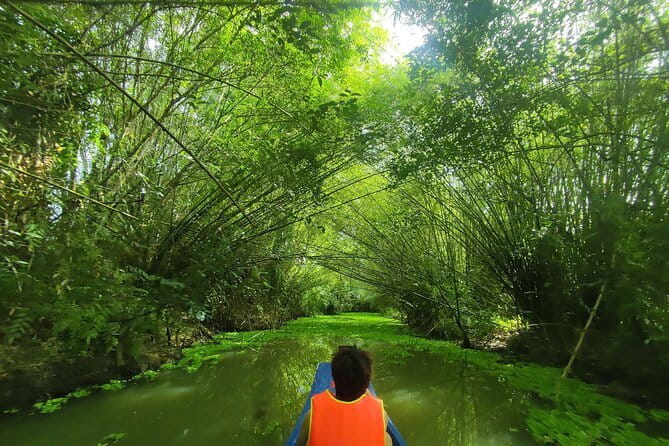Floating Market & Hidden Canals – Small Group Morning Boat Tour - Cai Rang land market: fruit and Mekong snacks on solid ground