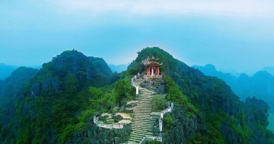 From Hanoi: 2-Day Ninh Binh Tour with Ha Long Bay Cruise - Day 1: Hoa Lu, biking, Tam Coc bamboo boat, then nearly 500 steps at Mua Cave