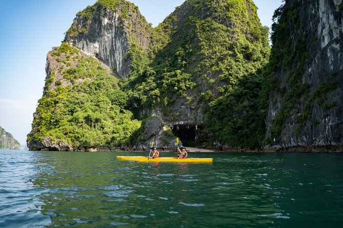 From Hanoi: 2D1N Ha Long Bay Deluxe Cruise with Bus Limousine - Titop Island: sand beach time, climbing for views, and a real sunset party