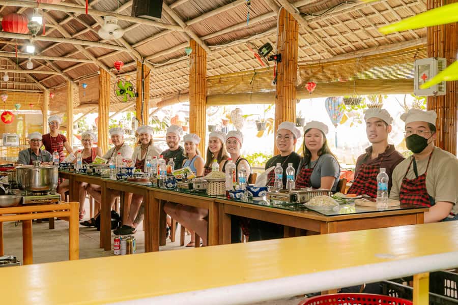 From Hoi An: Market Tour, Basket Boat Ride and Cooking Class - Folk songs, coconut-leaf souvenirs, and what makes it eco-friendly