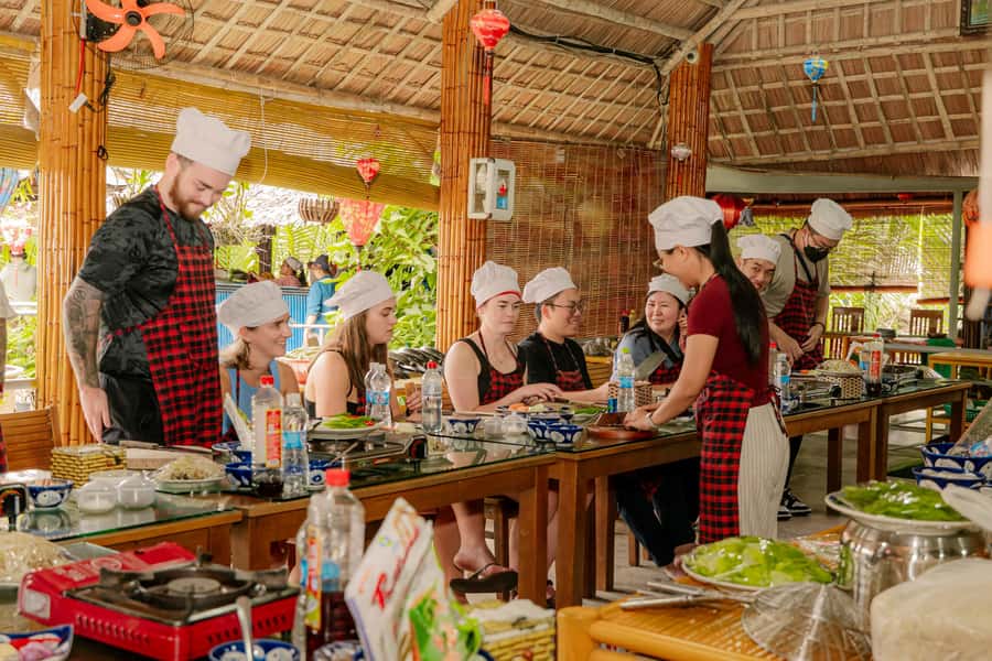 From Hoi An: Market Tour, Basket Boat Ride and Cooking Class - The cooking class setup: a water-side kitchen with real participation
