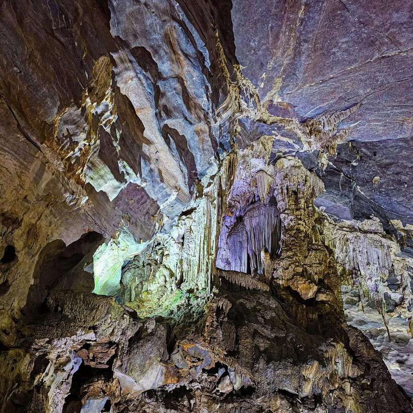 From Hue: Phong Nha Cave & Paradise Cave Full-Day Trip - Phong Nha Cave: A Boat Ride and a Flashlight-Lit World