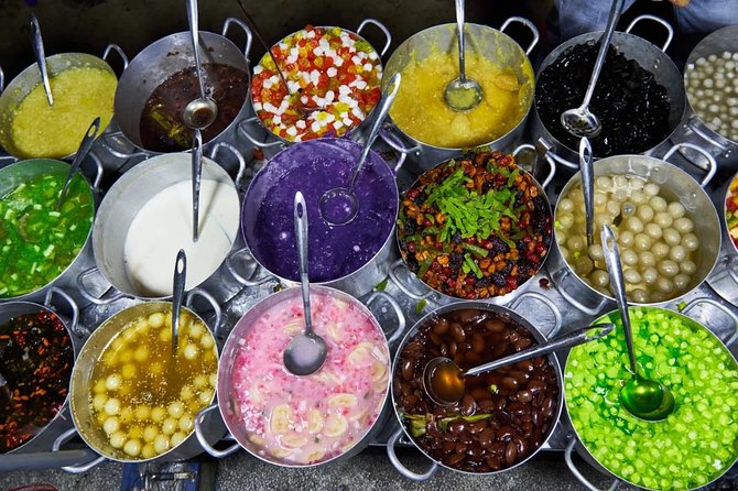 Half-Day Guided Street Food Walking Tour at Hue - Stop 4 at Quán Cẩm: Bún Bò Huế Turns the Volume Up