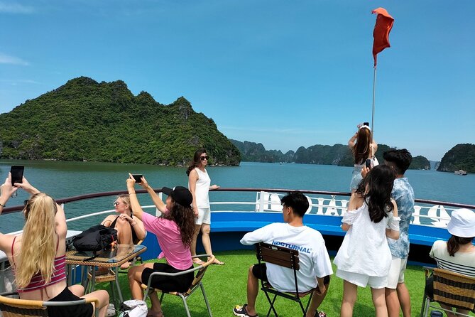 Halong Bay Day Tour With Titop Island, Cave, Kayak & Lunch - Sunset Party on the Way Back: Fruit, Cake, and the Best Deck Time