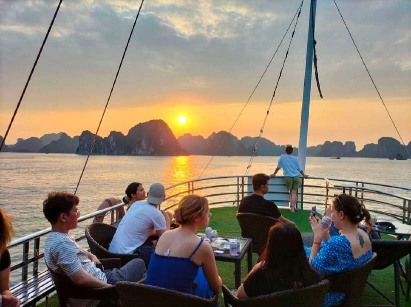 Hanoi: Ha Long Bay Day Cruise - Swimming, Meal, Kayaking - The sunset party onboard, when the bay turns into a postcard