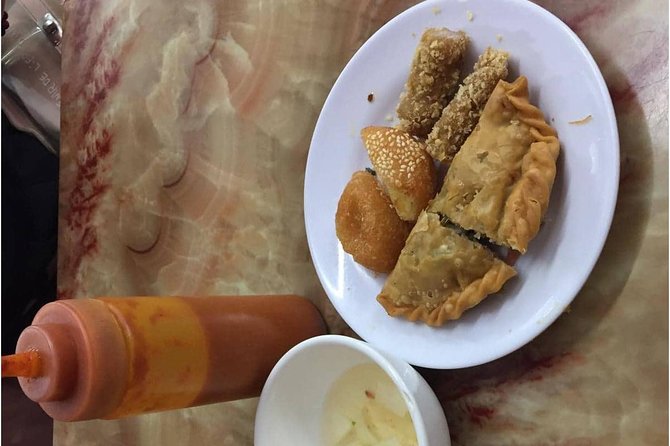 Hanoi Street Food + Night Life Tour - Stop One at Tran Nhat Duat Street: Market Energy and Food Traditions