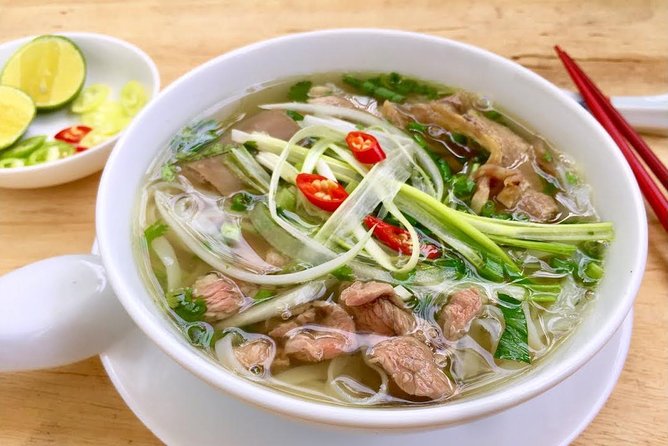 Hanoi Street Food: Small Group Walking Tour with Real Foodie - Hang Be market energy and hidden alleyway meals