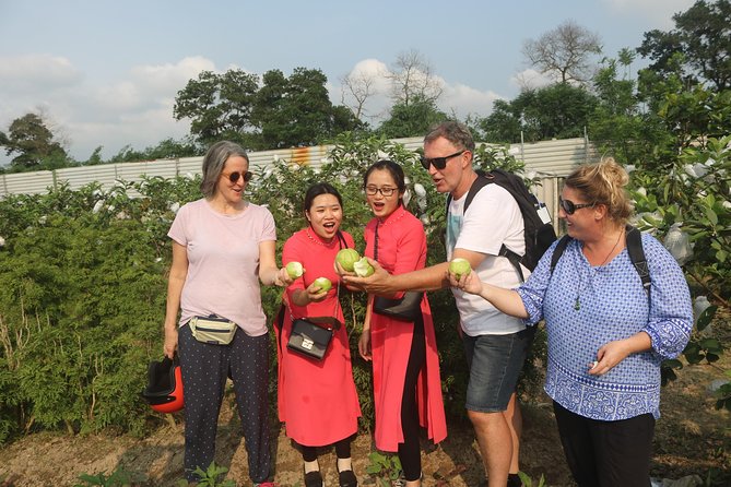 Hanoi Vespa Full Day City & Countryside with Female Ao Dai Riders - Long Bien Bridge and the Red River views from a vintage Vespa