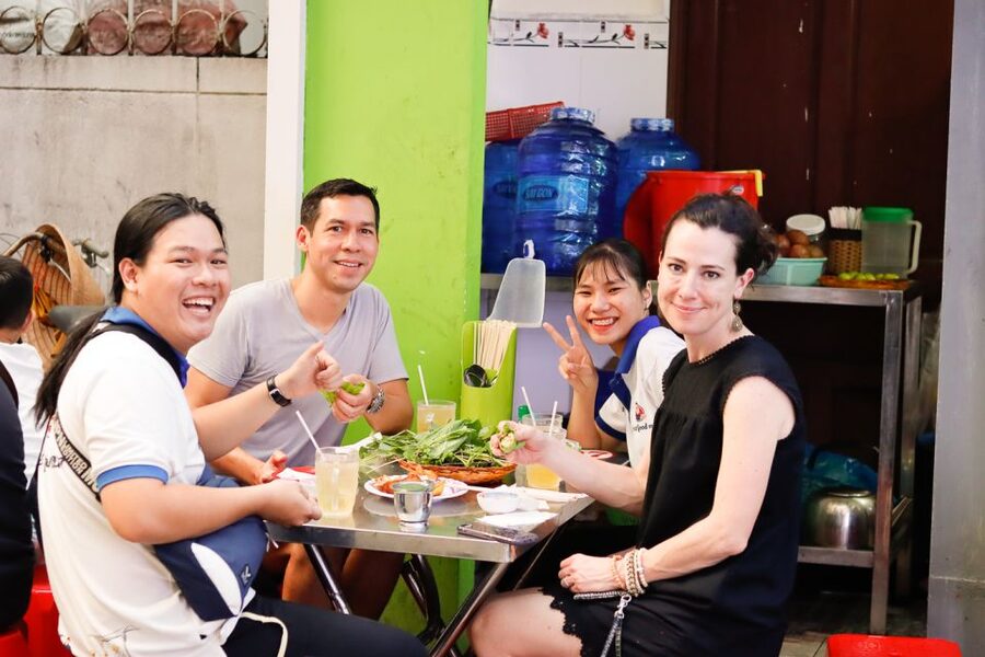 Ho Chi Minh City: Private Street Food Motorbike Tour - District 4 seafood meal, flan dessert, and banana sticky rice wine