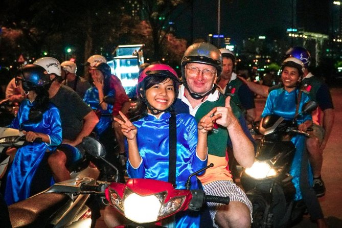 Ho Chi Minh Night Tour by Motorbikes with Female Rider | KissTour - Getting On Board: Helmets, Ponchos, and Safety Reality