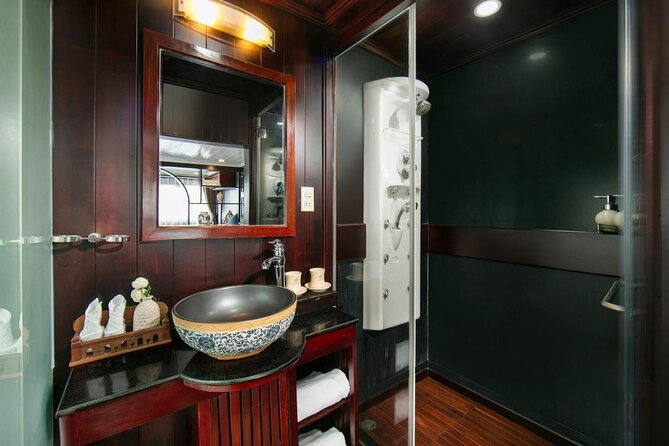 La Regina 2 days tour in Halong Bay & Bai Tu Long Bay - 4 star - The sundeck cooking class on night 1: spring rolls and a relaxed vibe