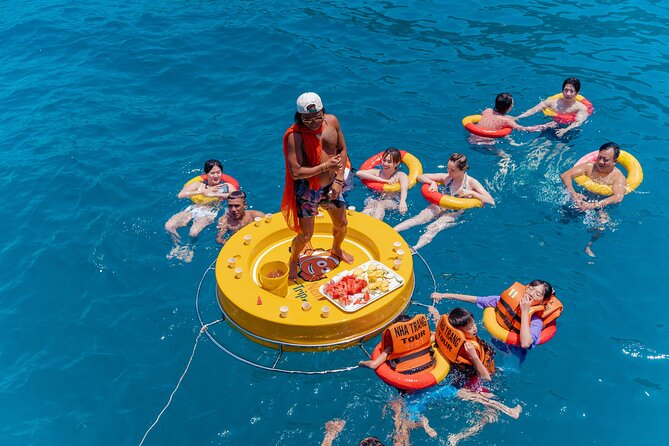 Nha Trang Island Hopping Tour Snorkeling and Floating Party - Stop 1 in Nha Trang Bay, floating bar happy hour with music
