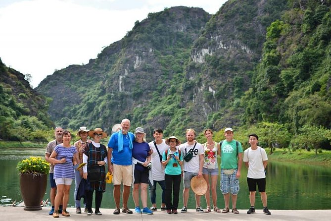 Ninh Binh Daily Tour: Hoa Lu - Am Tien Cave- Trang An boat ride - Trang An sampan caves: three hours of rowing, photo breaks, and emerald water