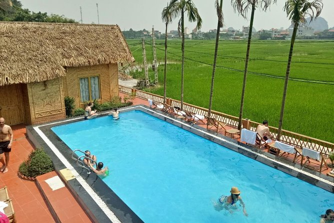 Ninh Binh Daily Tour: Hoa Lu -Mua Cave -Tam Coc- Bike-Swimming with Sunset Party - Mua Cave and the 500 steps to Lying Dragon Mountain views