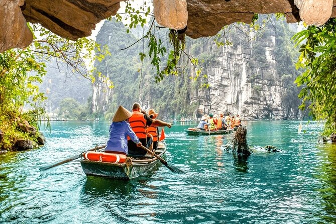Ninh Binh Day Tour Tam Coc Mua Cave Hoa Lu Buffet Lunch Limousine - Tam Coc Bamboo Boat Trip and the Three Grottos (Hang Ca, Hang Hai, Hang Ba)