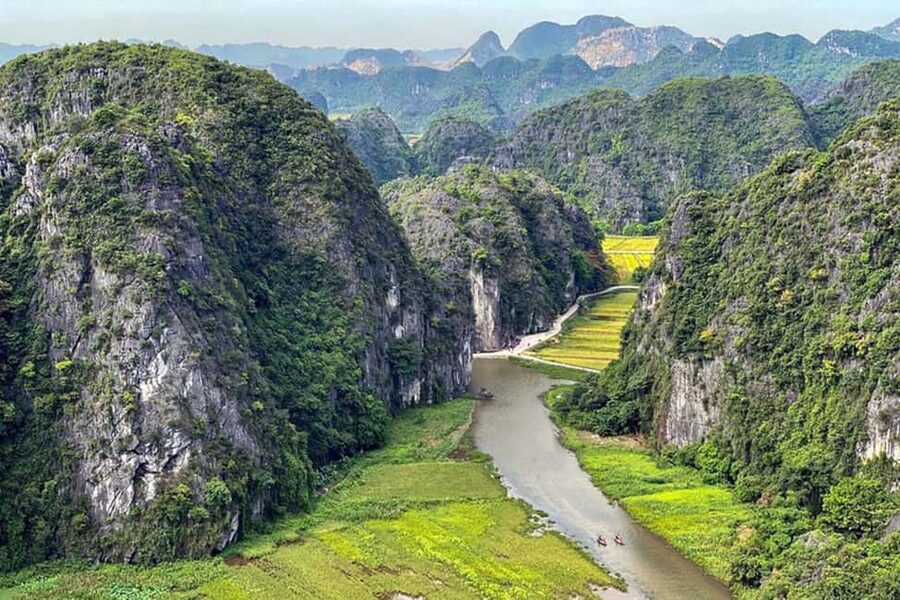 Ninh Binh: Trang An Boat Ride, Hoa Lu & Mua Cave Sunset - Trang An boat ride through caves, river turns, and hidden temples