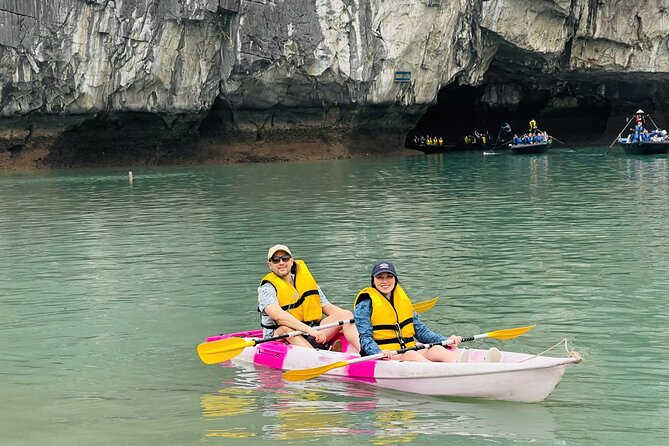 One Day Deluxe Boat Trip in Ha Long Bay - Lunch on the water, with limestone icons like Fighting Chicken and Incense Burner