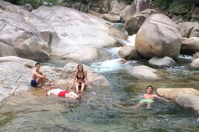 One Way Tour Dalat to Nha Trang or Nha Trang to Dalat - Hon Ba Nature Reserve: waterfall pools with swim, slide, and jump
