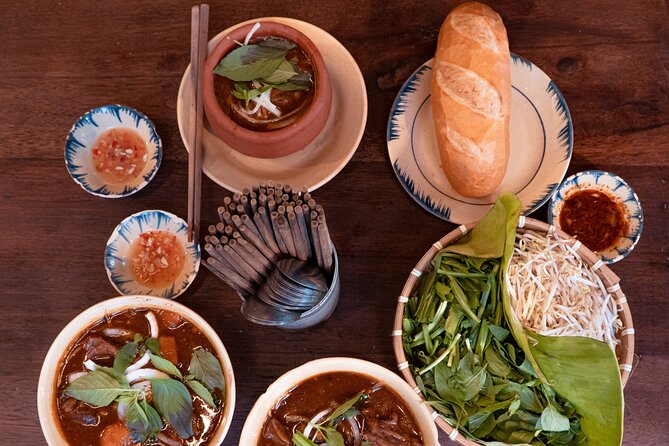 Private Street Food Motorbike Tour in Ho Chi Minh City - The surprise culture stops: pagoda-in-apartment and river-side views