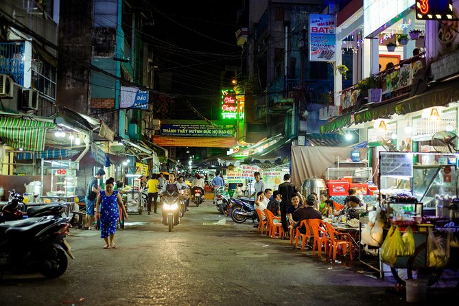 Private Vegan Food Tour By Scooter in Ho Chi Minh City - District 5 nightlife streets and the District 4 river bridge spin