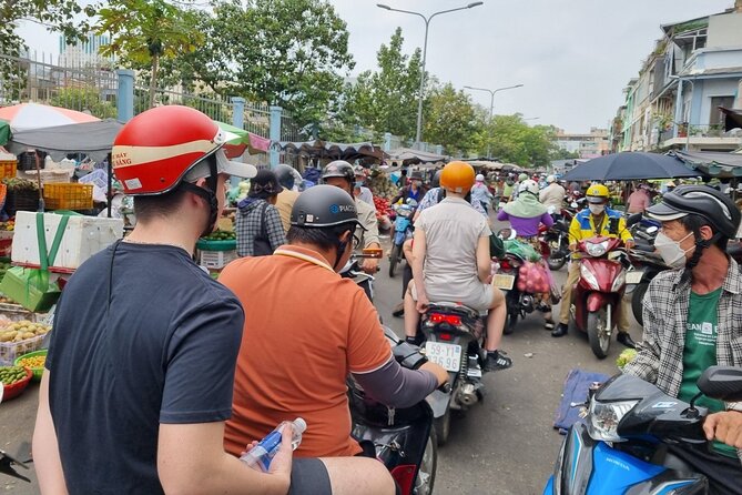 Saigon Private/Small Group Walking Food Tour with 13 Tastings - District 3 after dark: hidden apartment alleys and a flower market stop