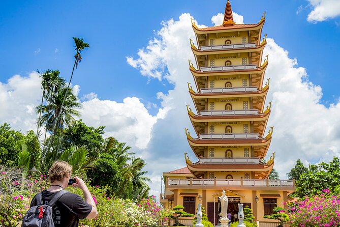Small-Group Mekong Delta Day Trip: Boat Ride, Cottages & Pagoda - Motorboat cruising, canal views, and Rạch Miễu Bridge moments