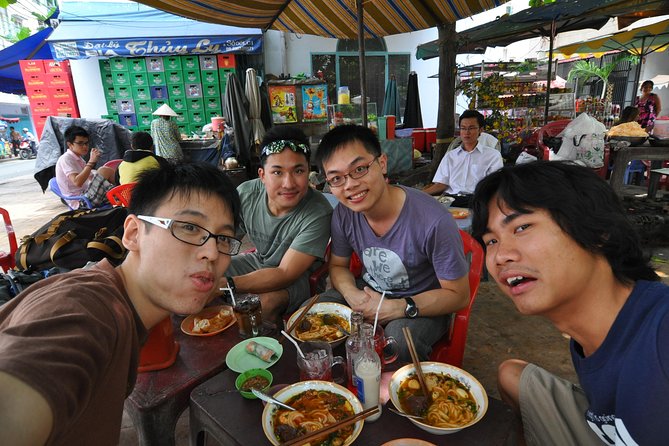 Small-group Street Food Lover by Motorbike (04 hours) - Stop 1 at Ho Thi Ky Flower Market: Cooking Demos and Food Choices